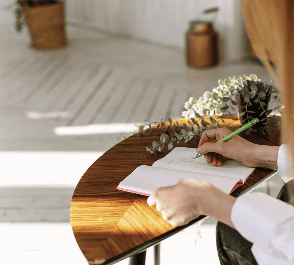 A woman journaling about the bible