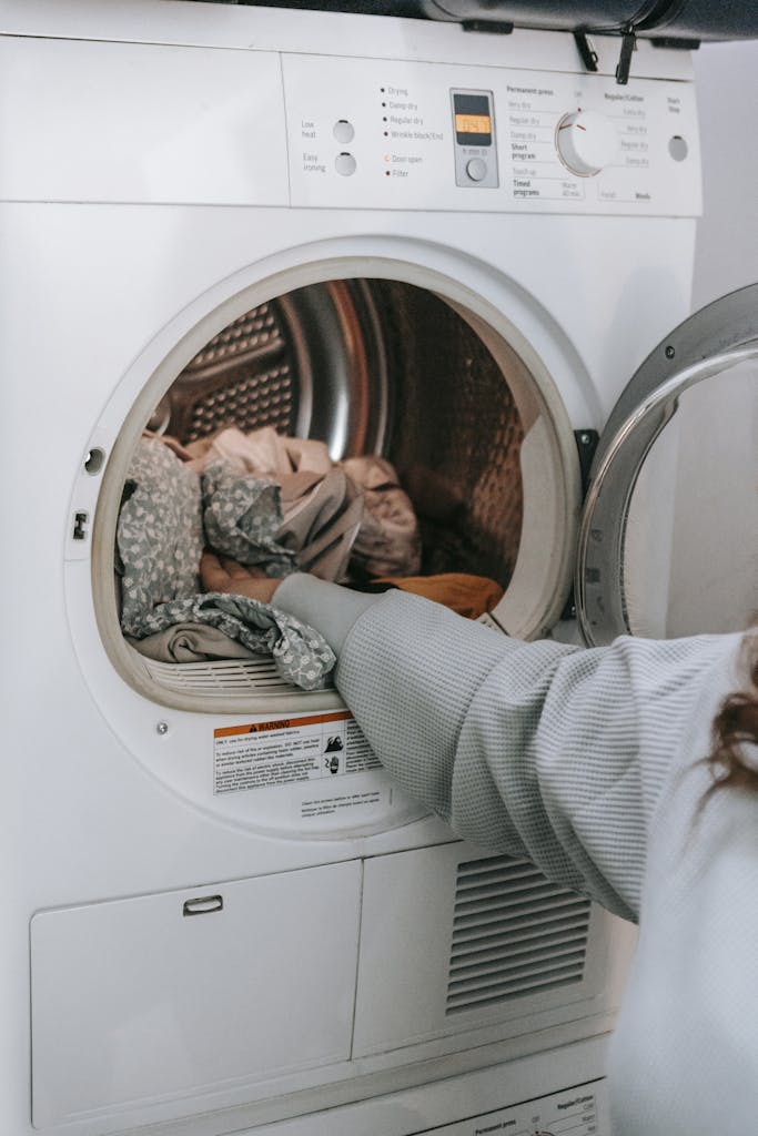loading clothes in washing machine