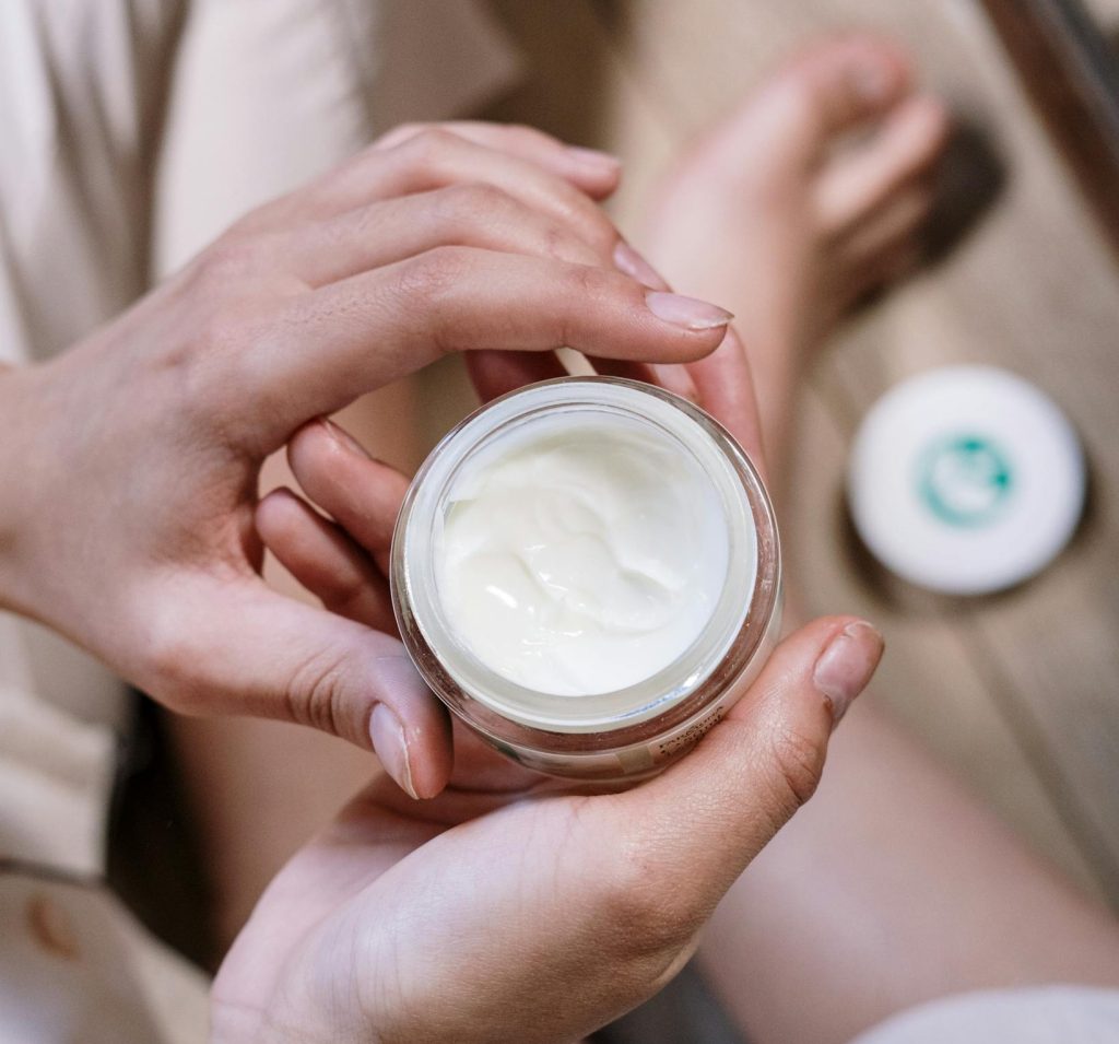 woman applying lotion